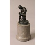 AFTER THE ANTIQUE: Spinaria or Boy with Thorn, bronze on a cylindrical marble base, height 20cm