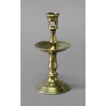 BRASS HEEMSKIRK CANDLESTICK late 17th or 18th century, with pierced sconce, central drip tray and