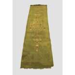 NARROW USHAK RUNNER Central West Anatolia, late 19th century, the olive green field centred by a