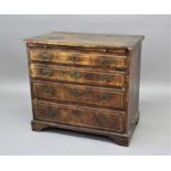 WALNUT CHEST OF DRAWERS 18th century, the cross and line banded top above a brushing slide and