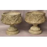 SET OF SIX COMPOSITION STONE JARDINIERES of ovoid form, cast with scrolling foliate decoration, on