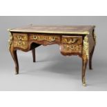 LOUIS XV STYLE BUREAU PLAT of bombe form, with an arrangement of five drawers over cabriole legs,