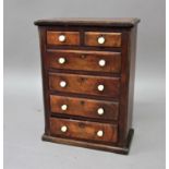 MAHOGANY MINIATURE OR COLLECTORS CHEST OF DRAWERS mid 19th century, the two short and four long
