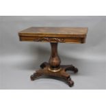 19TH CENTURY ROSEWOOD FOLD OUT CARD TABLE with carved, foliate decoration, on an octagonal, baluster