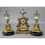 FRENCH GILT METAL AND PORCELAIN MOUNTED CLOCK GARNITURE the 3" dial painted with flowers on a brass,