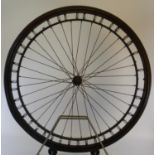 A 28-Inch Sprung Wheel. Fitted with solid tyring, a front wheel for a bicycle or tricycle, in