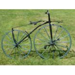 A circa 1870 Vélocipède. This bicycle has green-painted wheels, 36-inch driving and 30-inch rear,