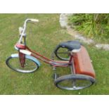 A Child's 'Winkie' Tricycle, with original red frame and rear box with hinging lid.