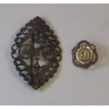 A Lady's Scarf Brooch. A pierced filigree brooch with a profile depiction of a lady's loop frame