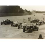 Motor Racing Photographs. 5 mounted images, four with the image measuring approximately 11 x 15-
