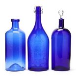 Three Large Cobalt Glass Bottles