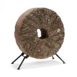 A Small Antique Millstone with Stand