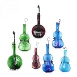 Group of Seven Musical Instrument Shaped Bottles