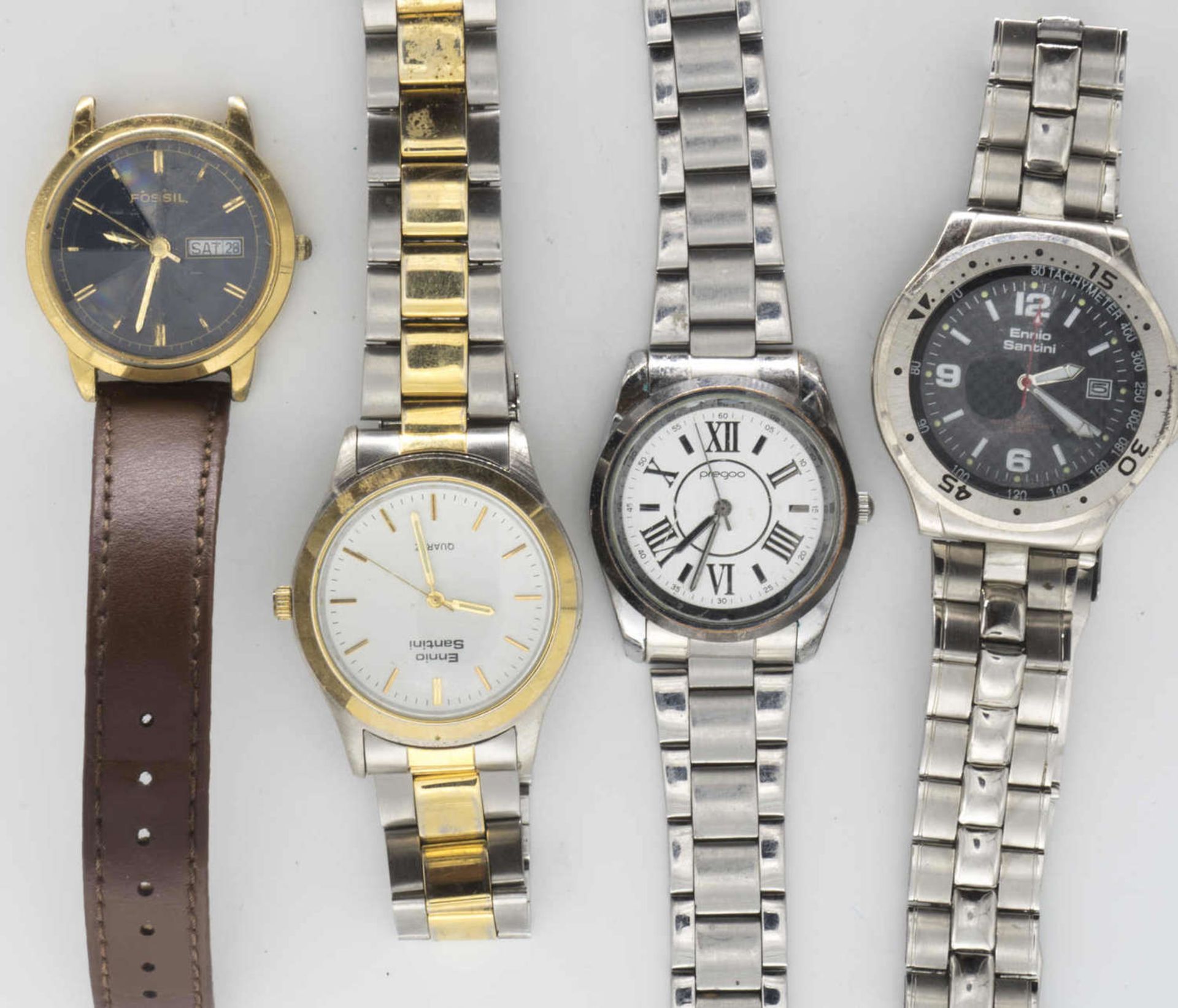 Lot of men's wristwatches, including Ennio Santini, Pregoo, Fossil. Please visit.