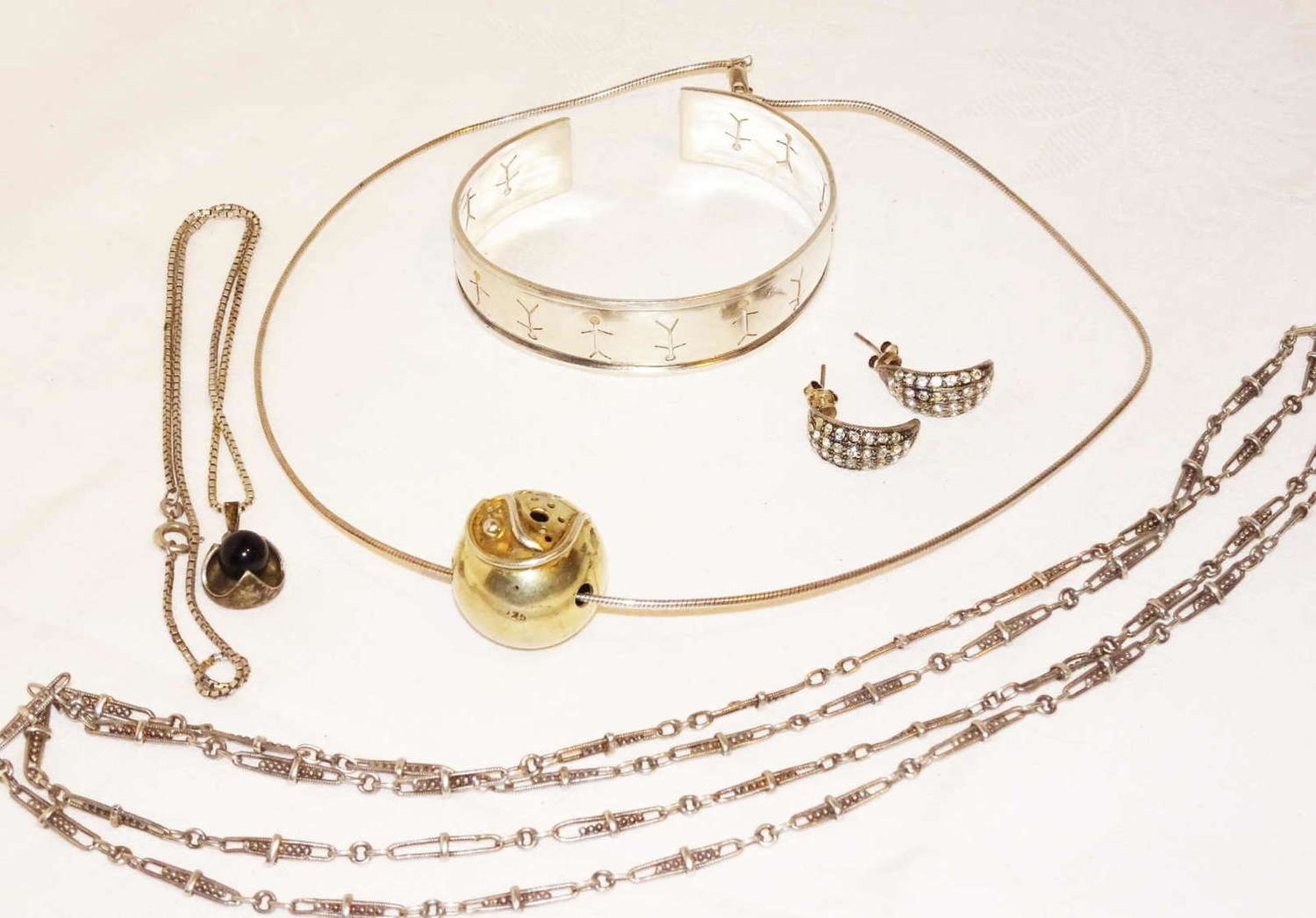 Lot of silver jewelry, including chains and earrings, bangle, weight approx. 63.4 g