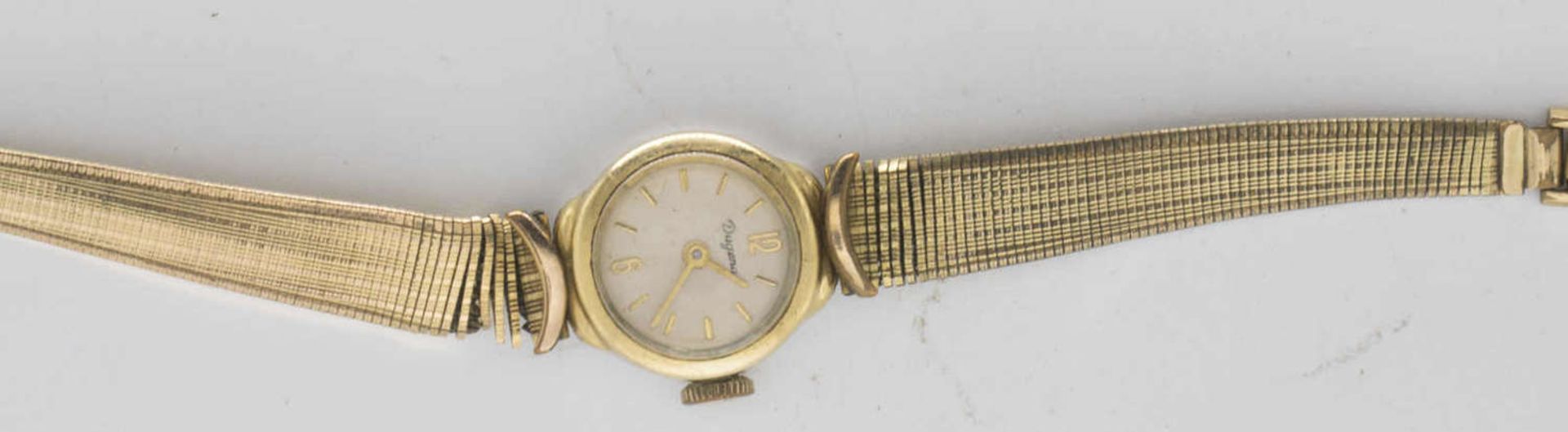 Dugena women's wristwatch, gold-plated. mechanically. The clock starts.