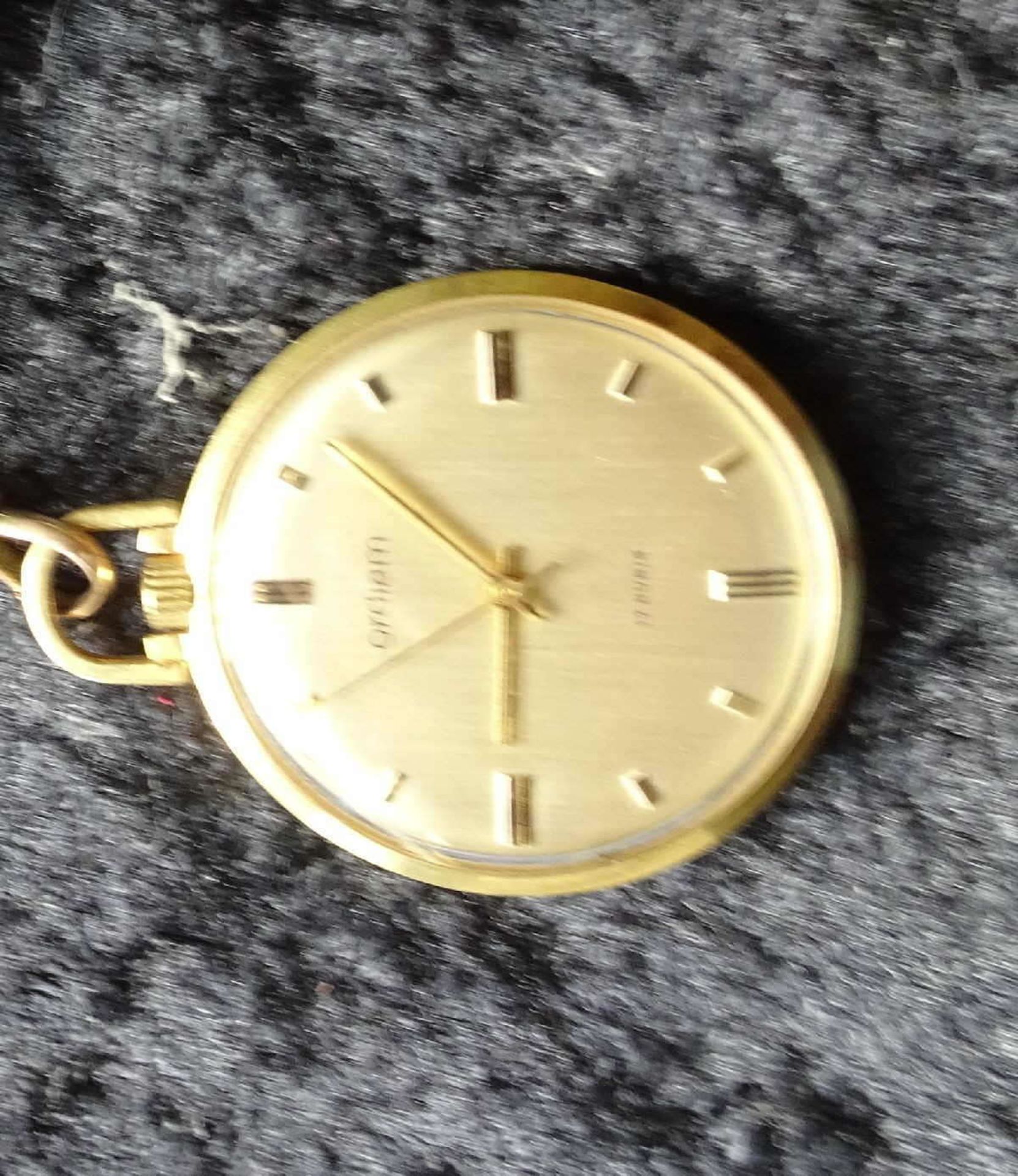 Pocket watch Ordiam, with watch chain. Mechanically. The clock starts. Good condition.