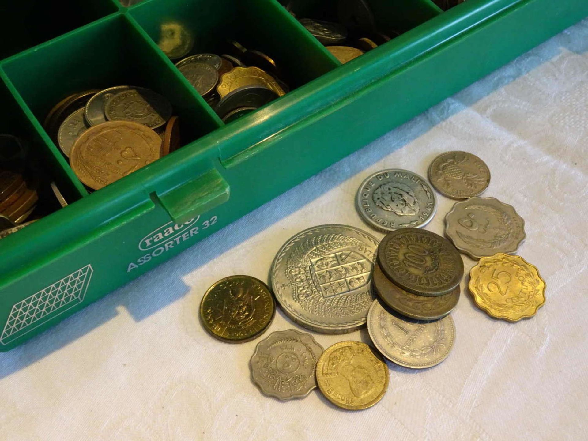 Lot of coins, all the world. Mostly African countries. Maybe treasure trove? Please visit!