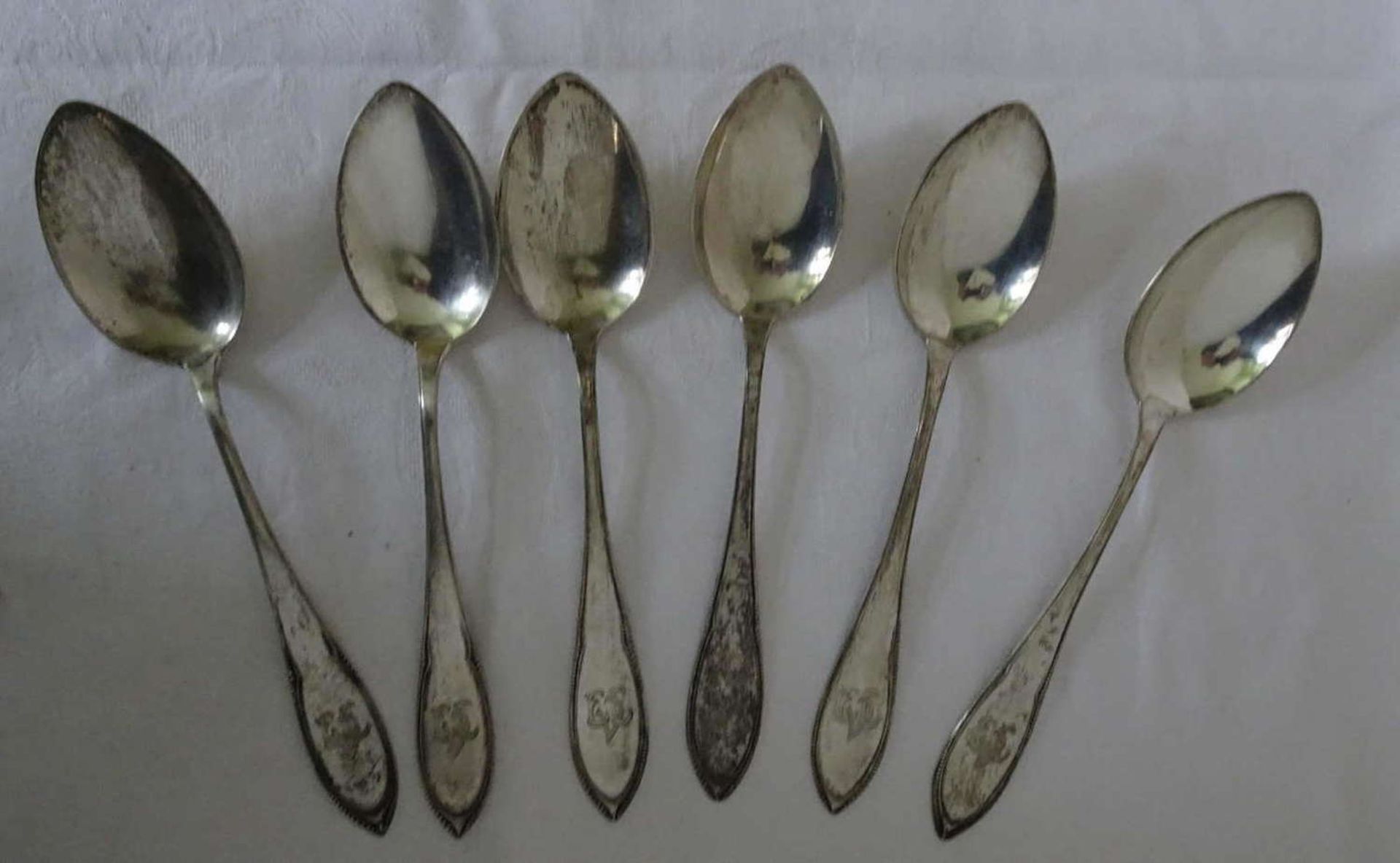 6 soup spoons, 800 silver, with monogram. Total weight about 243.6 gr