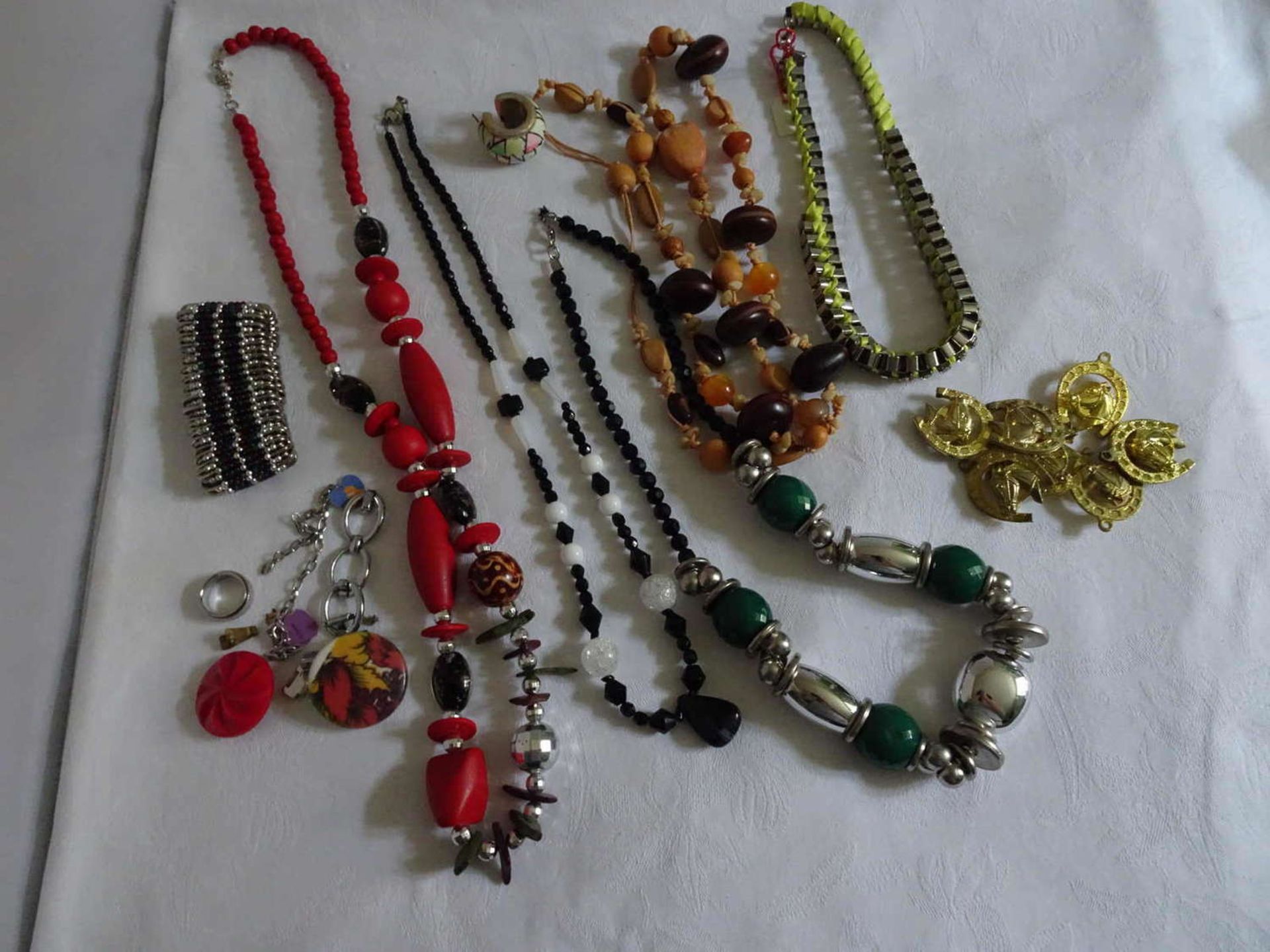 Large lot of costume jewelery, with chains, etc.