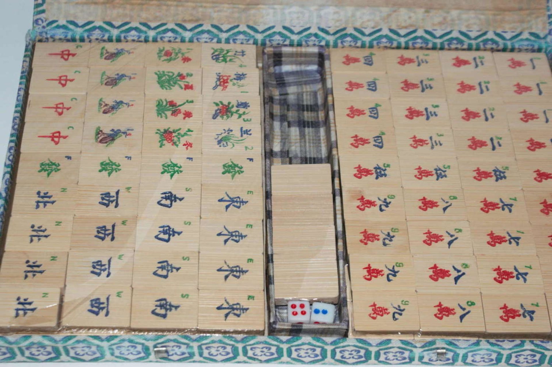 Mah-Jongg game, still in original packaging. Wooden pieces, 2 small plastic cubes.