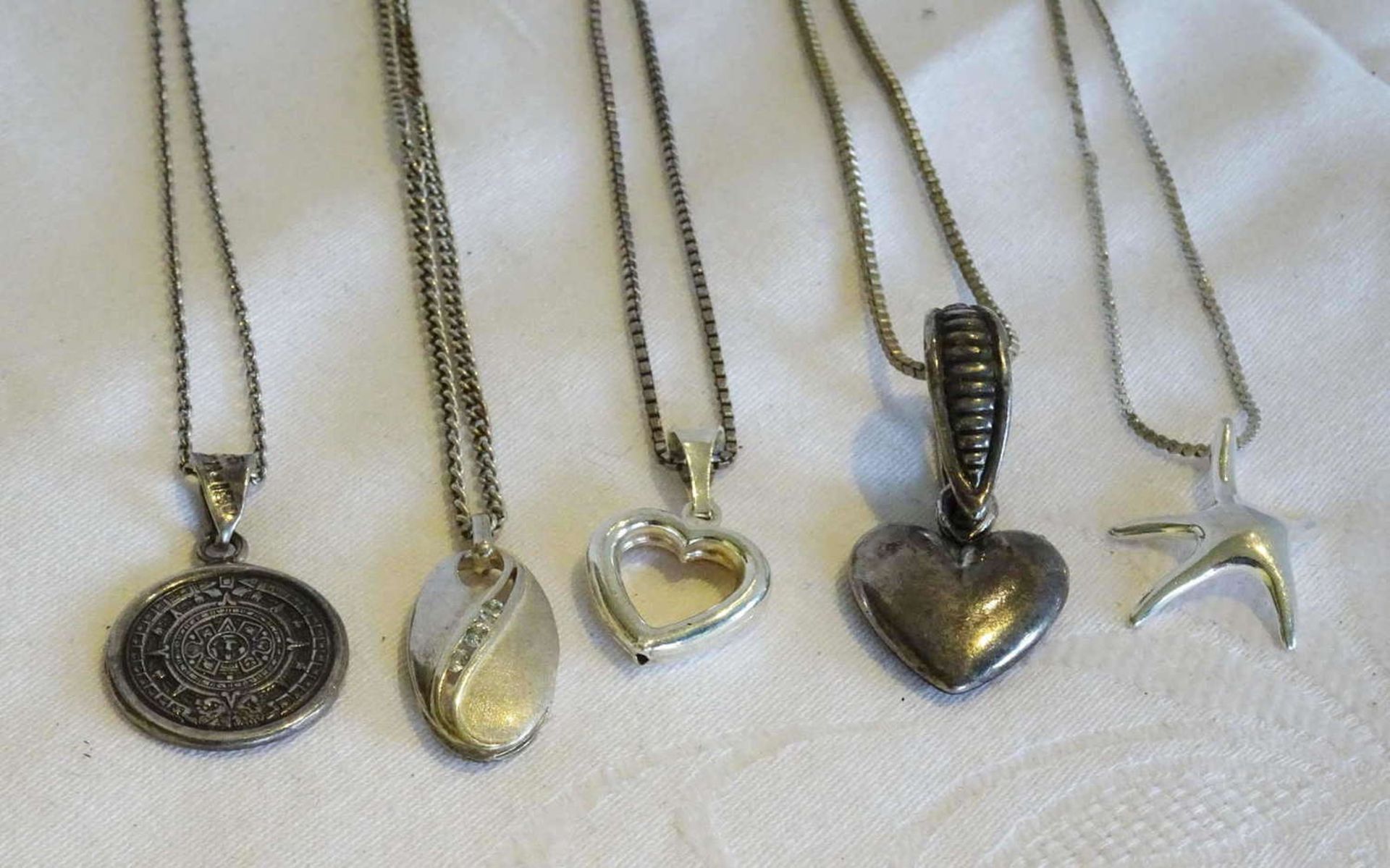 Lot of silver chains with pendants. Different models. Weight approx.40.1 gr.