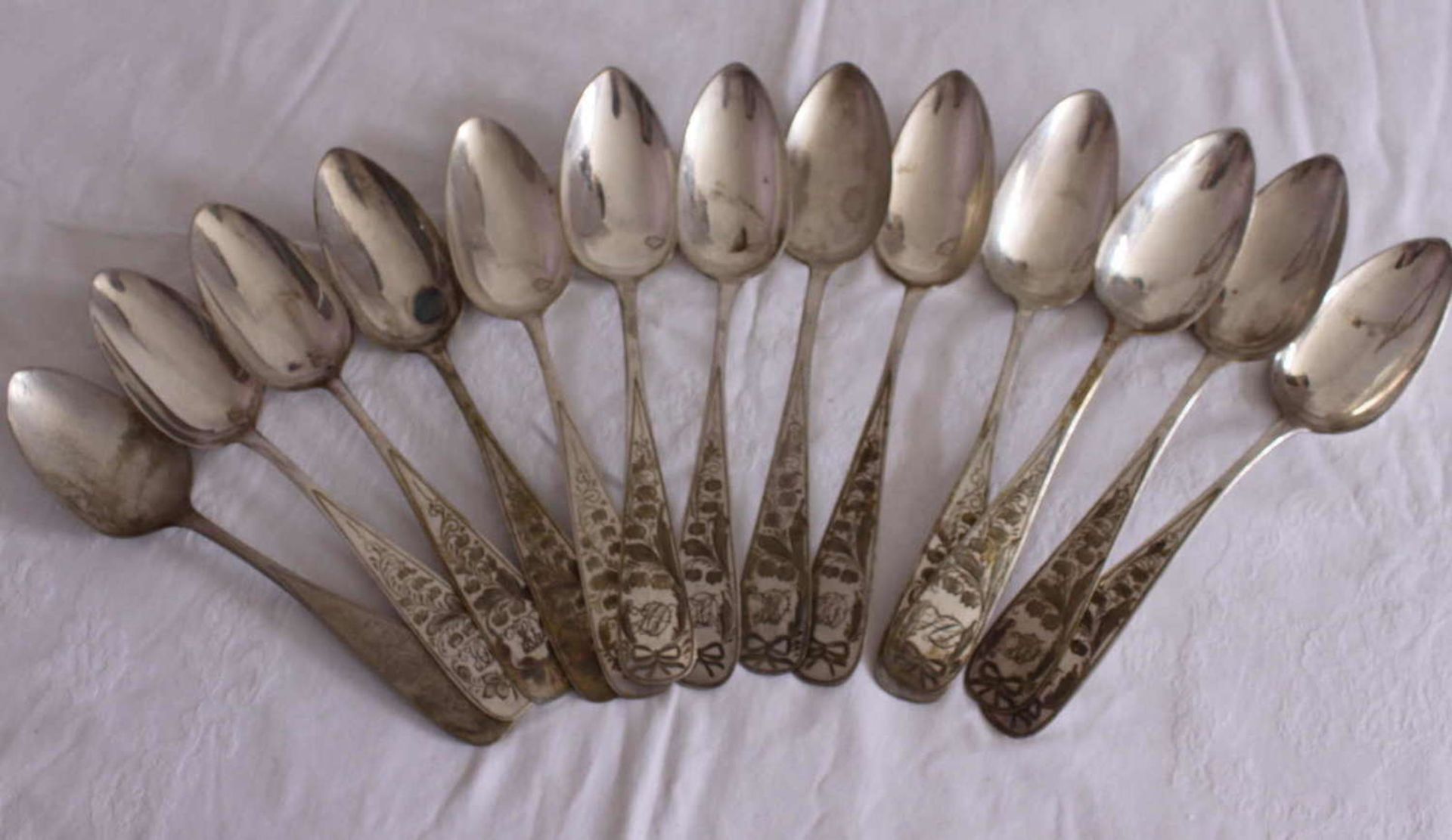 13 soup spoons, 800 silver, with monogram. Total weight about 550 gr