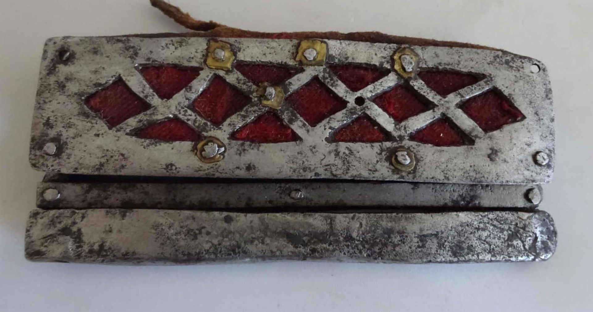 China, lighters and flint lighters, with leather and metal fittings in diamond shape. Around 1900.