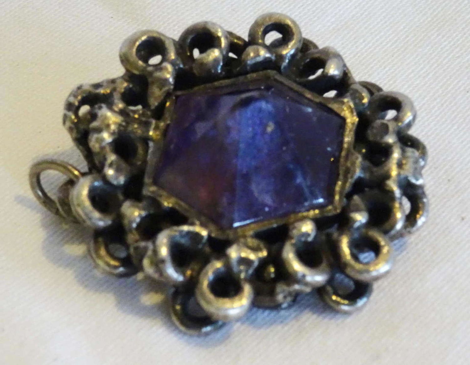 old pendant / brooch silver. Massive handwork. Set with amethyst. Stone damaged.