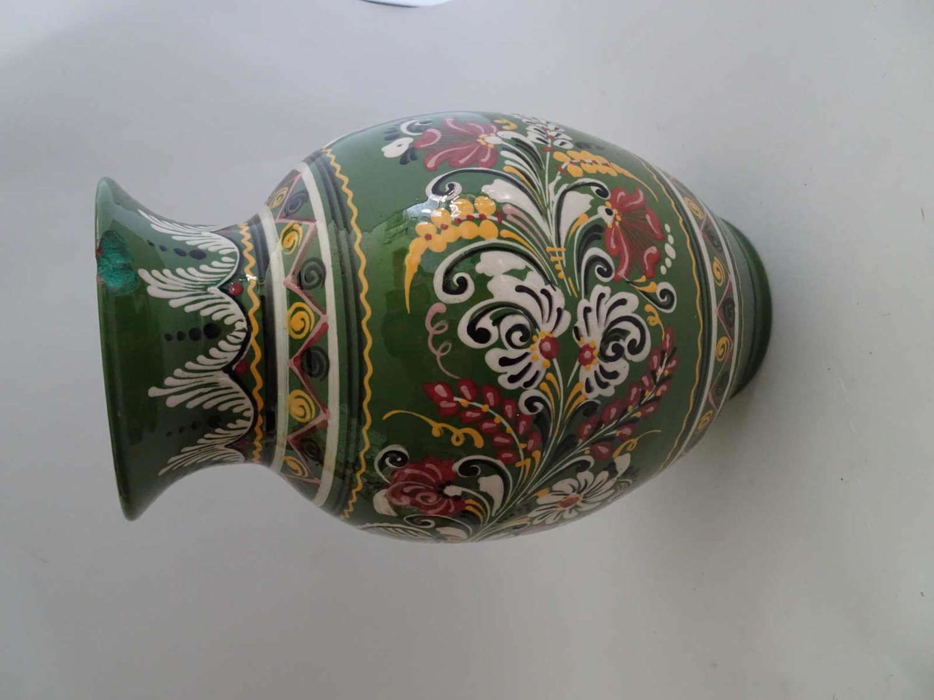 Old ceramic vase with floral decoration, scratched on the floor 71927. At the mouth glaze damage.