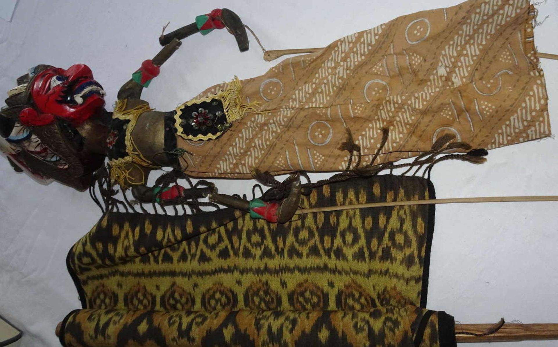 Indonesian dance doll and 1 batik silk scarf as a wall hanging.