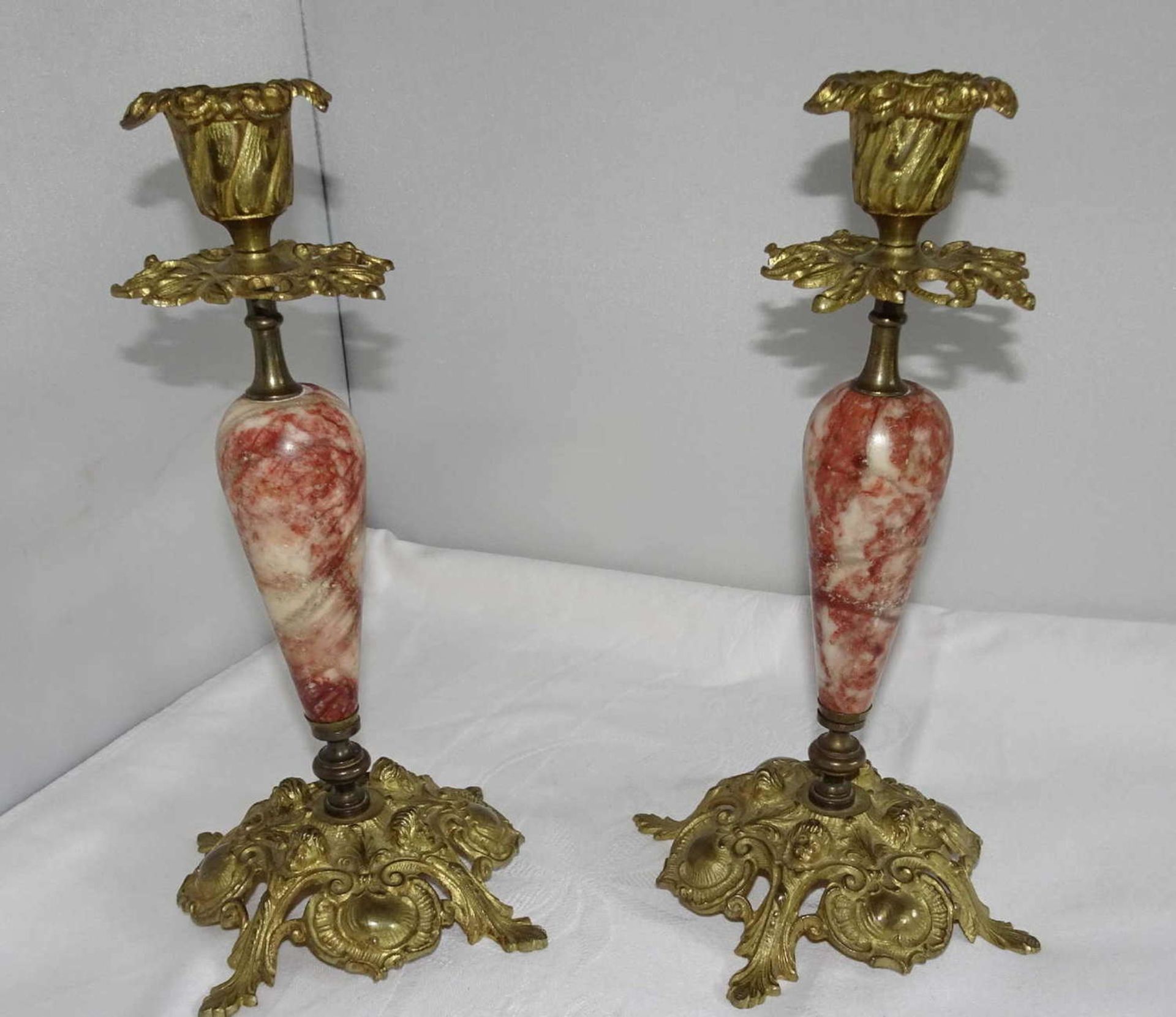 2 candle holders with marble base, bronze fire-gilt, approx. 22 cm high2 Kerzenständer mit