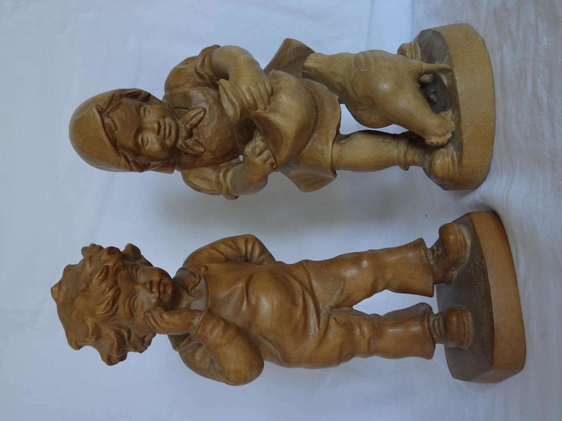 2 wood carvings from Grödner, Kaltern. 1x boy with bouquet, 1x girl with chicken. Very good