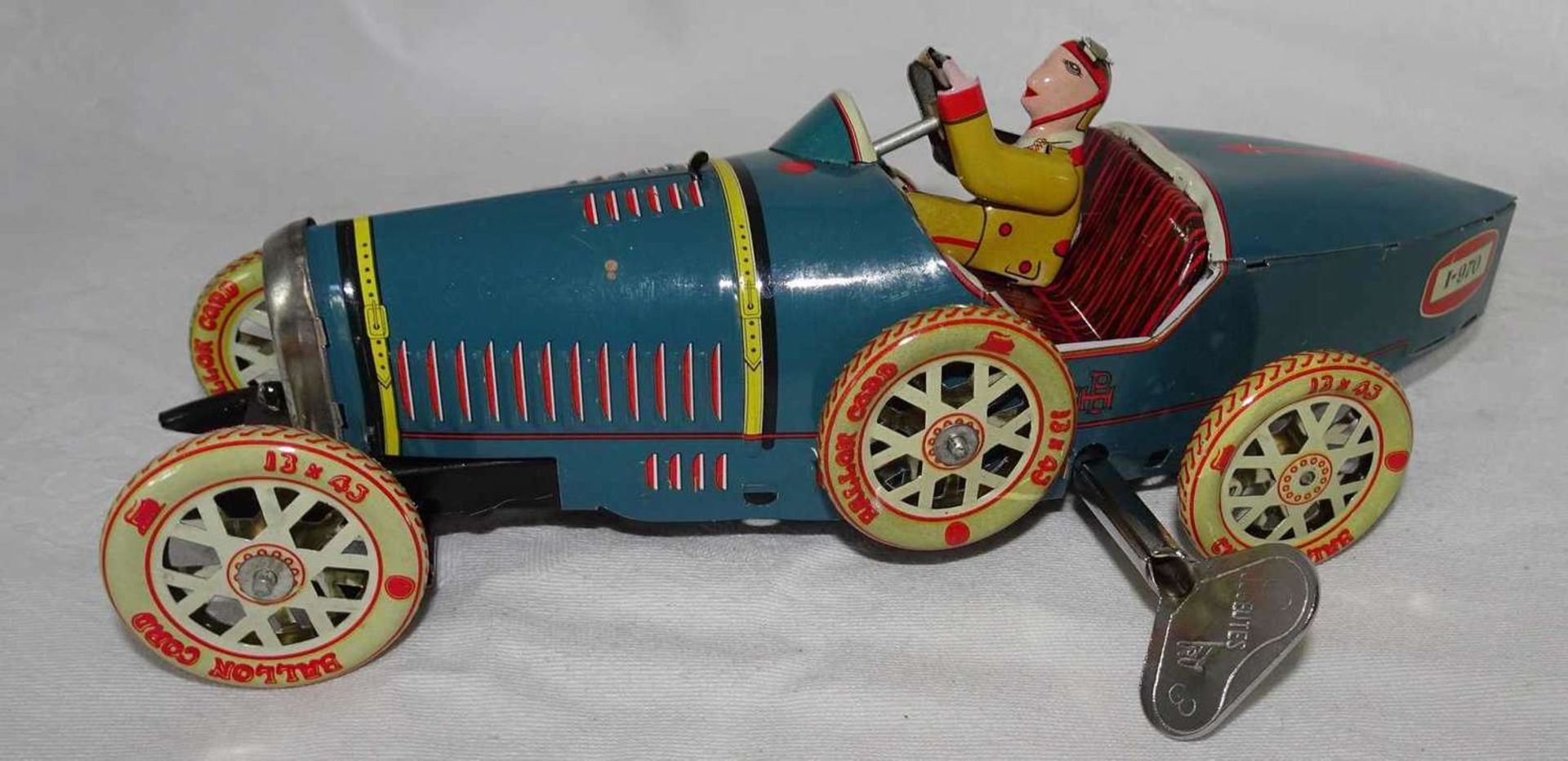 Tin toy - racing car model "Bugatti t-34" with driver. With key winding - key available. Retro.