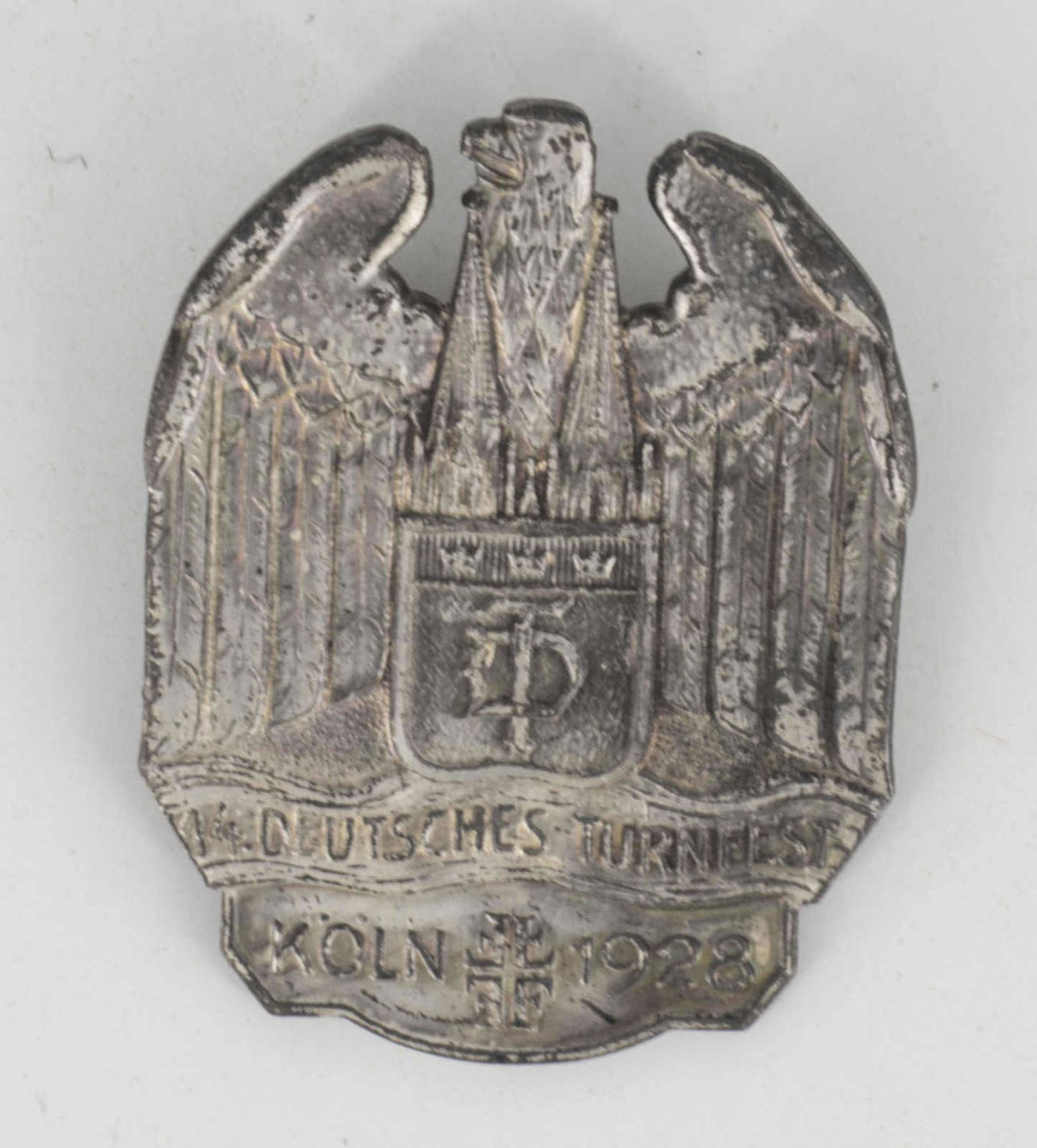 Weimarer Republik 1928, Abzeichen "14. Deutsche Turnfest Köln 1928" in Silber. Höhe: ca. 40 mm.