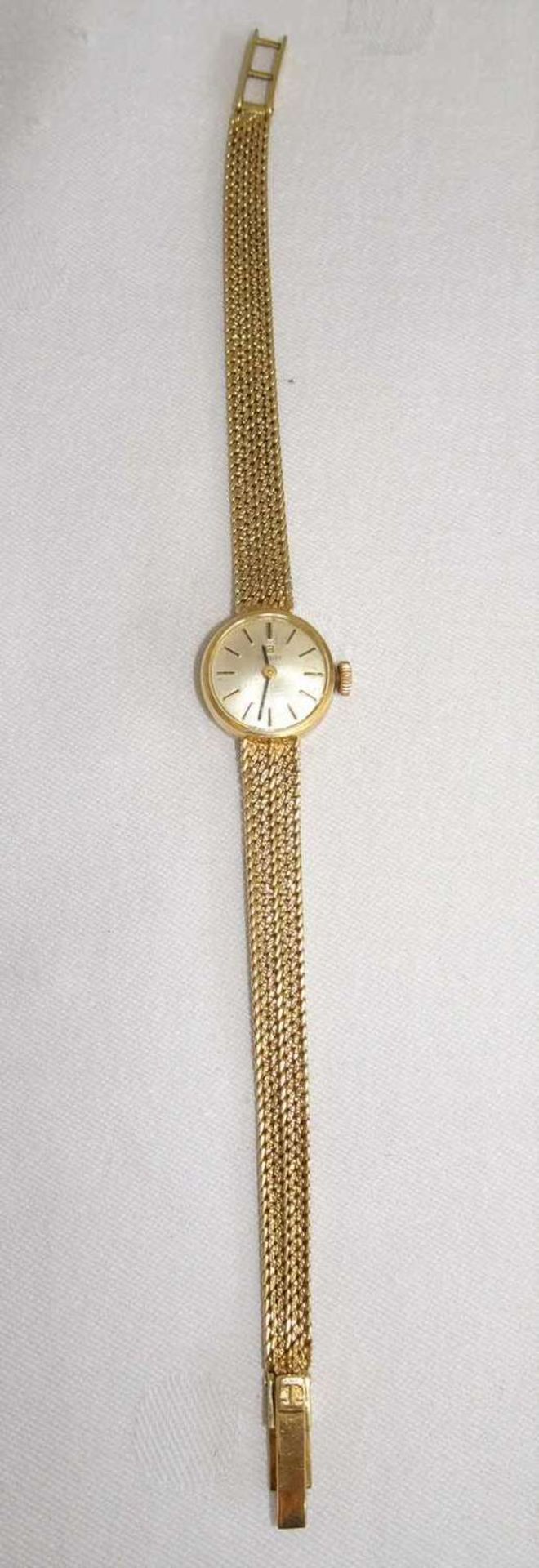 Damenarmbanduhr TISSOT, massiv, 585er Gelbgold. Gewicht ca. 18,6 gr.