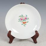 A Chinese porcelain famille rose shallow footed dish, Qing Dynasty, the interior decorated with
