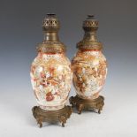 A pair of Japanese gilt metal mounted Satsuma pottery vases converted to paraffin burning lamps,