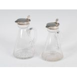 A near pair of George V silver mounted clear glass whisky noggins, Birmingham, 1917, makers mark