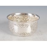 An Edwardian silver bowl, London, 1900, makers mark of ERP, with embossed decoration of flowers,