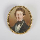 A 19th century portrait miniature of Gentleman, in gilt metal frame and under glass, the reverse