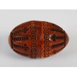 An 18th/ 19th century lignum vitae egg shaped pomander, formed in two sections, with pierced and