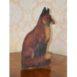 A late 19th/early 20th century carved and painted pine Country House door stop in the form of a