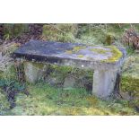 An early 20th century stone garden bench, the rectangular seat on two demi-lune section supports,