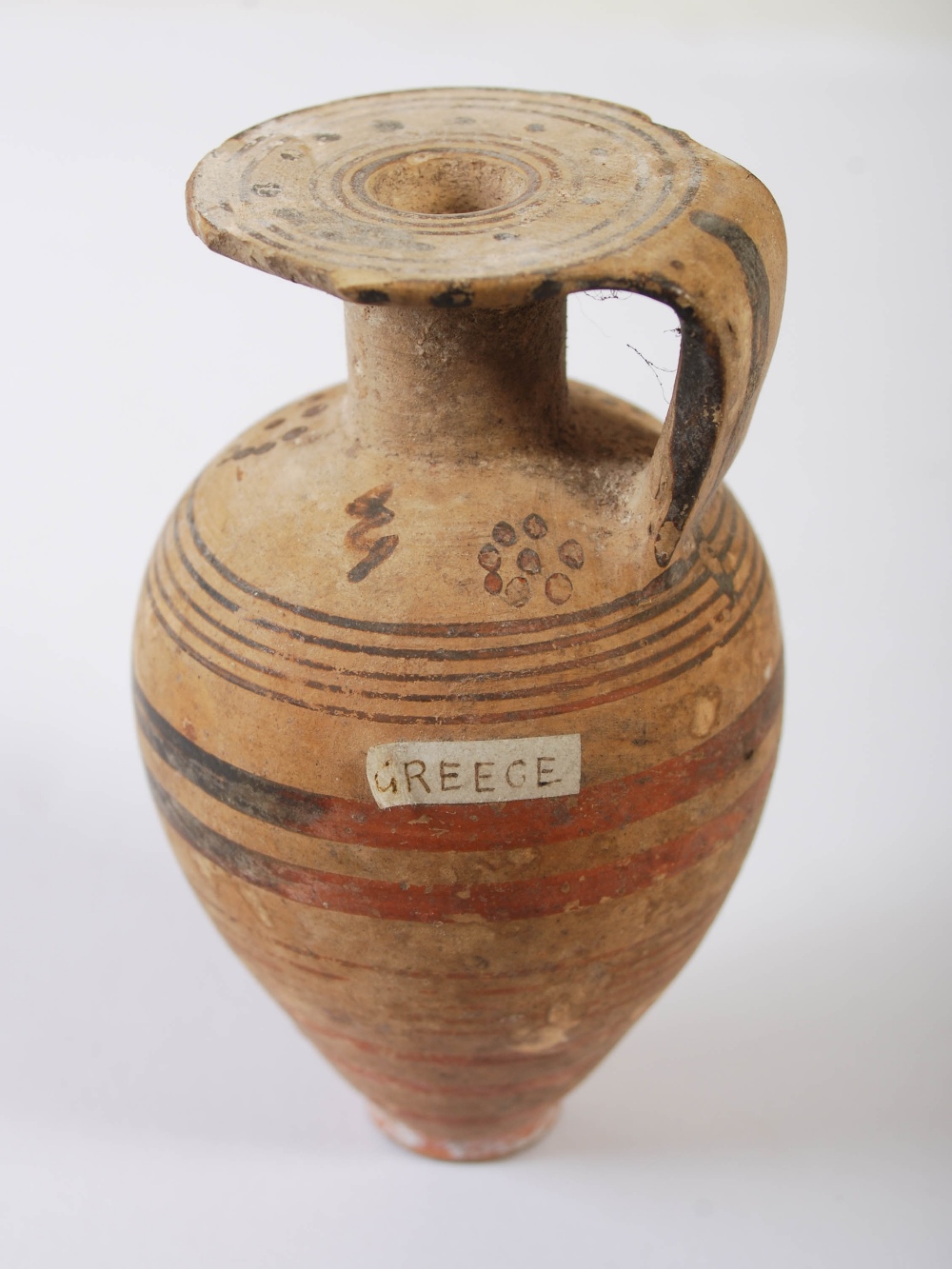 Antiquities- A collection of Ancient Roman pottery, comprising; small aryballos with oviform body - Image 4 of 14