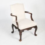 A George III Irish style mahogany armchair, the calico upholstered back and seat flanked by shaped