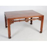 A Chinese huanghuali writing table, Qing Dynasty, the rectangular top above a pierced and scroll