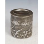 A Tudric pewter round biscuit box and cover designed by Archibald Knox for Liberty & Co.,