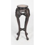 A Chinese dark wood jardiniere stand of small size, Qing Dynasty, the circular top with a mottled