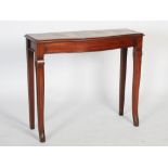 A 19th century mahogany bow front console table of slender proportions, the shaped rectangular top
